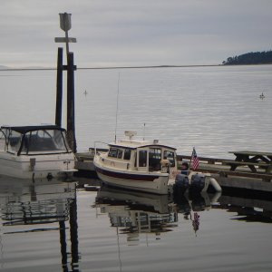 Sequim Bay dock quiet time.  Both boats the same length, not the same size though.