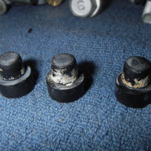Carb parts, showing mineral deposits.  Probably from untreated (Stabil) fuel that sat in the boat before I bought it.