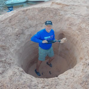 Digging a hole for the anchor at Oak Bay.