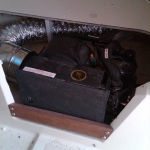 Mermaid AC home w.duct under starboard V-berth.  Had to cut webbing on access hatch to fit.