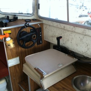 Helm with seat folded; manual sink. Port-a-potti is visible in lower left corner of the photo.