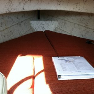 V-Berth with binder with manuals for electronics and boat registration.