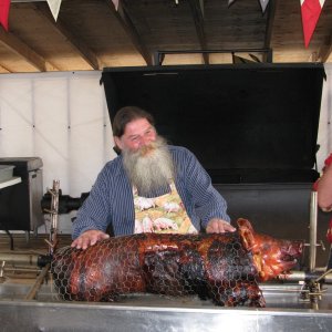 Pierre showing off the roast pig