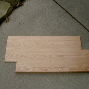 Media '(Valkyrie) Step one: basic shelf with cut-outs for Wallas tank and through-hull hoses.  Shelf is secured to oak blocks attached to bulkheads with screws and West System epoxy.  Fiddle is 3" tall,1/4 inch thick.  Fiddle is also reinforced for sturdiness by a 1"x 1" piece of oak that is attached by glue and screws.' in album '(Valkyrie) Final product.  Oak galley shelf doubles usable space under galley.  Shelf is 19" deep and the width of galley.  Three inch fiddle keeps stuff from doing a backflip in a seaway.'