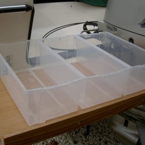 Media '(Valkyrie) Step two: finding the right storage containers to fit.' in album '(Valkyrie) Final product.  Oak galley shelf doubles usable space under galley.  Shelf is 19" deep and the width of galley.  Three inch fiddle keeps stuff from doing a backflip in a seaway.'