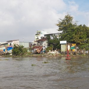 Although 50 miles up from the ocean, the lower Mekong is still tidal.  I wouldn't trust that buoy.  I saw plenty of them on shore.