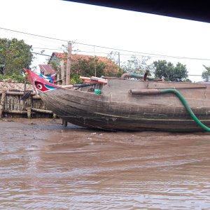 It looks like it was re-purposed. It now pumps water out of a canal connecting the upper and lower Mekong. There was no place to go ashore and see what the water was used for.