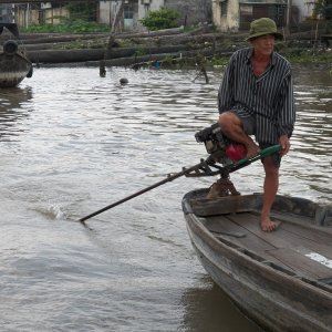 Smaller boats had lawn mower size engines.  Steering with your feet seemed to be popular.  He might be looking for his flip flop.