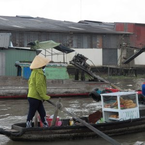 Hand propulsion was still around.  She will sell you a plain baguette or make you a sandwich (banh mi).