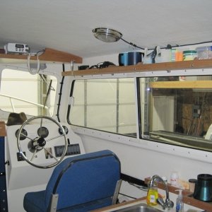 Media 'Home made shelf above starboard window' in album 'Cockpit of Long Story with daughter and Wounded Warriors opening day at Westport. Picture shows our style of boat with rear helm.'