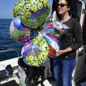 Picking up balloons is one of the sad duties of owning a boat