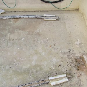 Closer look at the plastic strips under the tank.