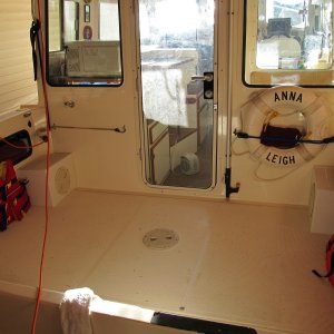 Media 'Cockpit with new steps' in album 'Leaking tank. Bottom of pic is too the stern. Two spacers in bilge have worn hole in tank about 1 1/2" up from the bottom'