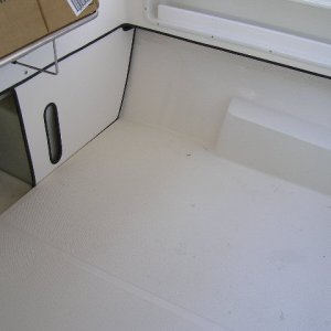 Molded in cockpit floor.