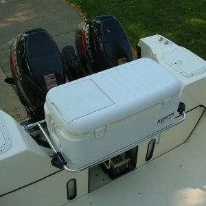 Large Igloo cooler and stainless steel rack in engine well