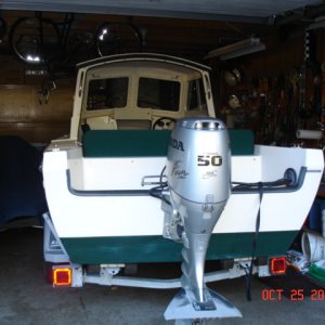 CD-16 Angler squeezed into packed garage for wtr07-08 - back on the water as soon as ice is out!