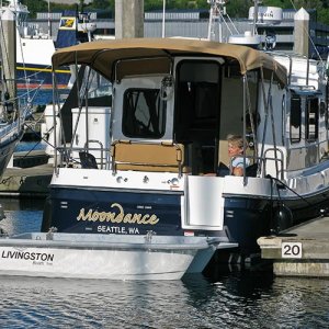 Moondance - dinghy down transom view - note hand winch on port side of cabin door