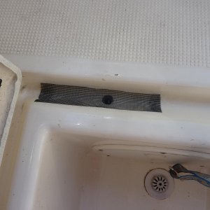 Media 'hole in drainage lip covered with screen to keep ou debris' in album 'hole in fishbox'