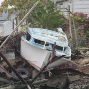 they say the hull deck joint is the weakest part of the boat. It looks like this one failed big time. It looks like she took a good shot on the nose. this bad boy needs an extreme make over.
