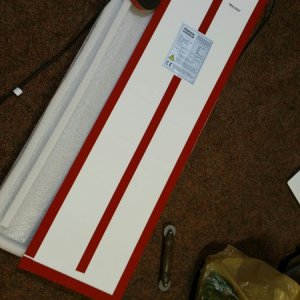 1 inch wide high bond 3m tape.  Small gaps on one side are for drainage on the low edge if any water sneaks behind it