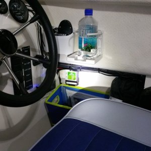 Charge controller (green) tucked against wall with velcro.  Simple PWM unit from Camping World