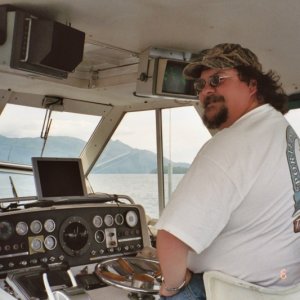 At the helm.