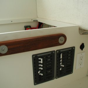 Media 'Separate 110v. panels for shore power only loads and inverter pass through loads.' in album 'Overhead Console in place with 2 Icom radios and Outback Inverter "Mate".'