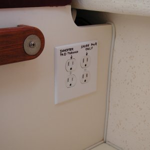 New outlets below passenger seat. One side is shore power only, other is inverter pass-through.