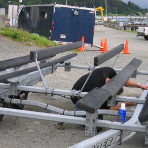 Moving the axles on my trailer to the max forward postion just after purchasing the boat.  This is before I cut the tops off the U-bolts that were gouging the hull and before I moved the bunks back closer together that the previous owner had spread apart.