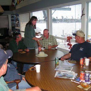 Pat feeding Roger dessert.