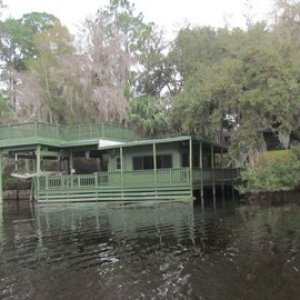 House with a boat lift many along the river