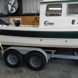 Added a second axle and SS disc brakes to trailer.  Boat came with one 3500 lb axle.  That seemed to light for the job.  Trips to Key West and Lake Powell were uneventful.