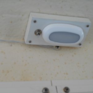 I bought two LED lights, two microswitches, and made 2 reading lamps for the upper berth.