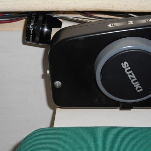 Media 'Mounted it on an angle on the outboard side of the throttle mount.  It's out of the way and yet handy when needed.' in album 'Kicker mount and trim planes.'
