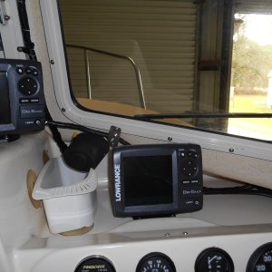 I added this motorized windshield wiper.  It bolted into the old mount hole.  It came with a new arm and blade, but I modified it to use the same items as on the port side.  Self parking. This wiper self destructed after a few years so I went back to manual. KISS.