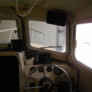 Rear-view monitor and on/off switch, over helm station.