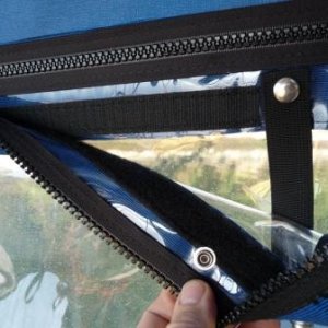 9. Velcro shown on the top of the window aft, to secure the cockpit canvas access door.