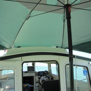 Media 'Attach with ball end bungee to hand rail.' in album 'Sport Brella as a Bimini at anchor'