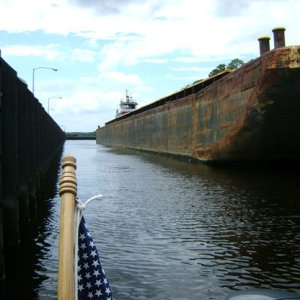 Tug Lorette and barge in lock with us