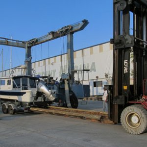 lifting the stern to get access for the strap