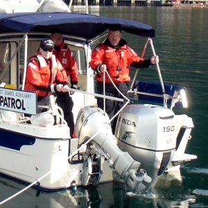 Crew attaching line with skiff hook.