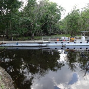 A year of construction, after severe flooding, represented by the work barge, which people, material and vehicles are brought to the Island to repair the damage.
