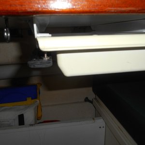 The drawer is the common plastic RV one that I see on many boats.  Easy to mount, works great, but no latch. I got tired of my bungy cord stop gap method.  Here, you push down the latch with your thumb as you pull out the drawer.  It latches when you return the drawer.