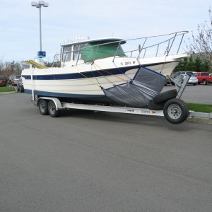 Waiting for 1st mate at Burlington, Wa. mall. 
Windshield and hull covered.
Heading to Alaska