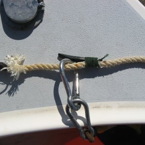 Media '6/29/2012. Homemade buoy latch on my anchor line in the "captured" position. Anchor/chain to the left and hangs on the latch after pulling the anchor.
Latch is made from a nylon boat cleat with the base cut off.' in album 'High Tide; 
1983 22' Angler(Classic)'