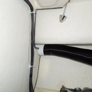 Forward air return vent in V-birth, temporary vent hose attached leading to forward area of birth.