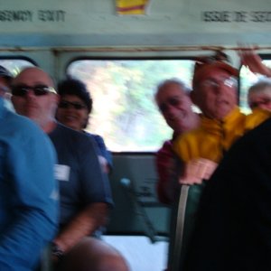 The bus is bouncing so hard that it's real easy to get a blurry photo! Can see Dan, Tanya, Roger and Ken!