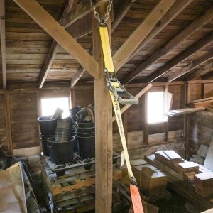 I used four ratchet straps and two recovery straps to hang the boat. The ratchet straps are attached to chain that's bolted to ceiling beams. The ratchets can be used to raise or lower the boat to reposition jack stands, or remove or replace the trailer.