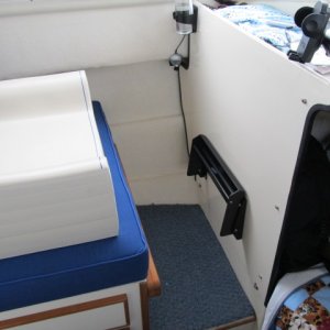 Booster cushion and folded foot rest for co-pilot