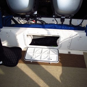 The added middle hatch is great for storage and also allows the bilge to air out nicely while resting at the marina.  The side hatches have battery shelves and don't provide the same level of ventilation